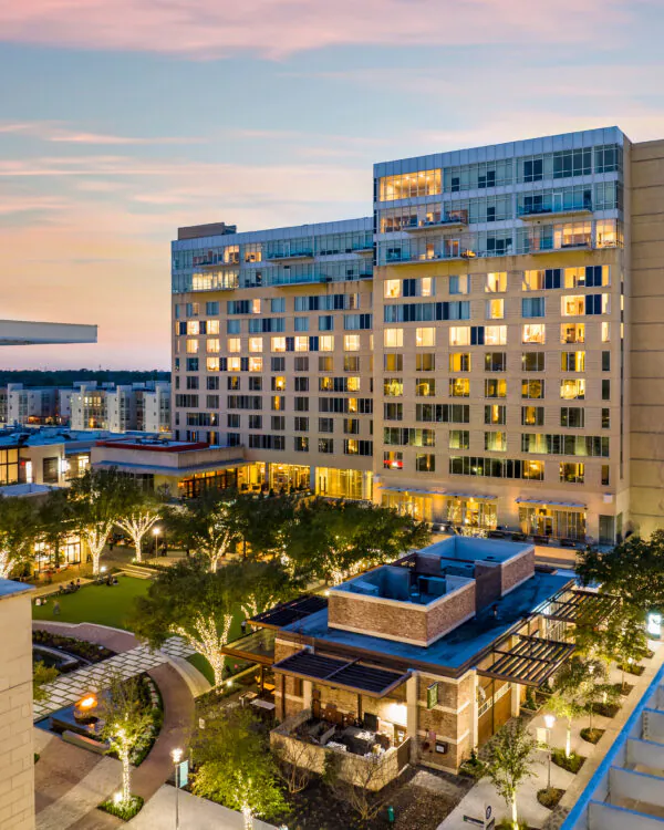 View of a large The Moran Hotel with outdoor pool area.