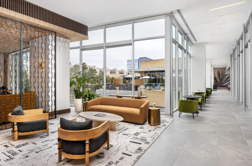 Seating area with large windows and modern furnitures.